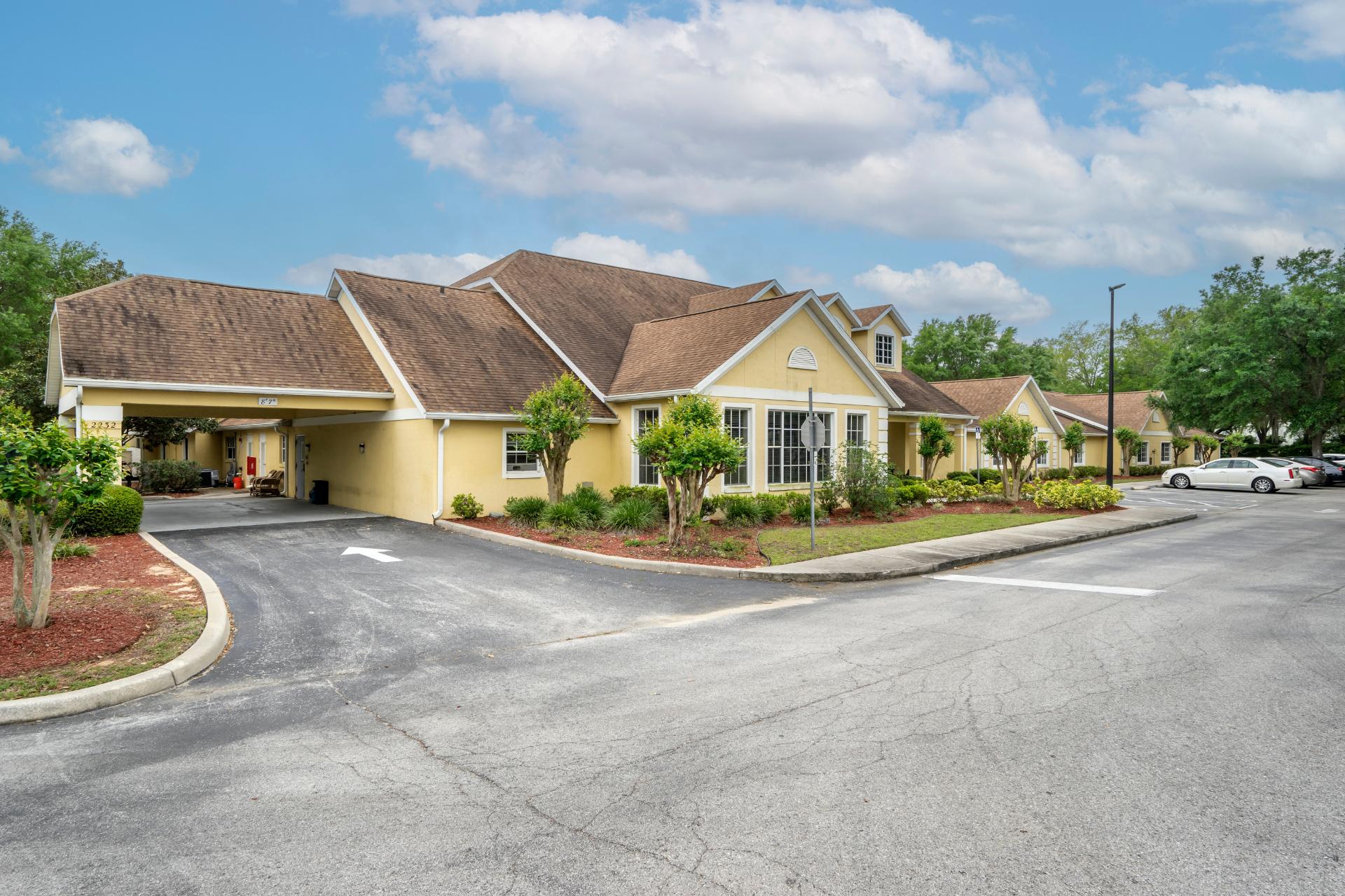exterior entrance with covered seating and entryway